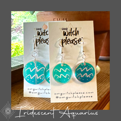 Round Iridescent Acrylic Earrings with an astrological symbol for Aquarius on a business card that says OMG Witch Please