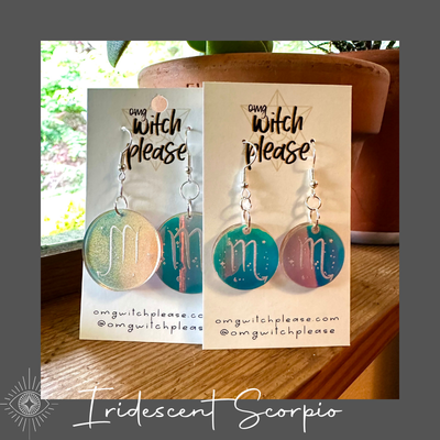 Round Iridescent Acrylic Earrings with an astrological symbol for Scorpio on a business card that says OMG Witch Please