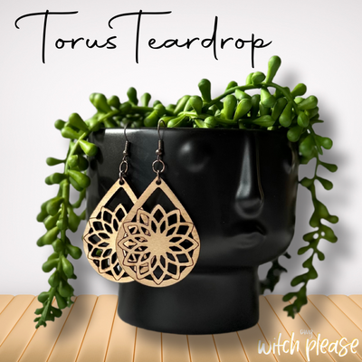 Laser-cut wooden earrings with a Torus Teardrop mandala design