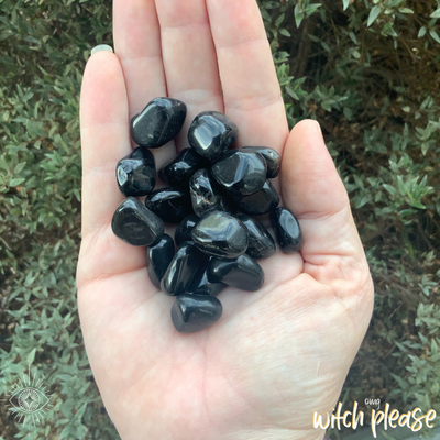 Tumbled Black Onyx in an open hand