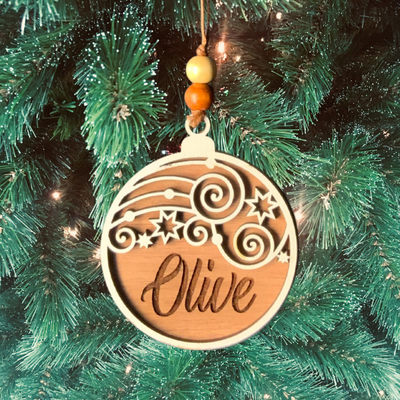 Custom Christmas ornament with starry night design laser cut from wood