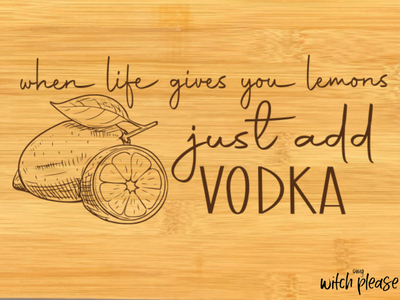 A mockup of a small bamboo cutting board that says When life gives you lemons, just add vodka" and a lemon illustration