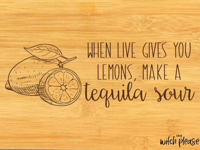 Mockup of a bamboo cutting board with a lemon illustration and the words "when life gives you lemons, make a tequila sour"