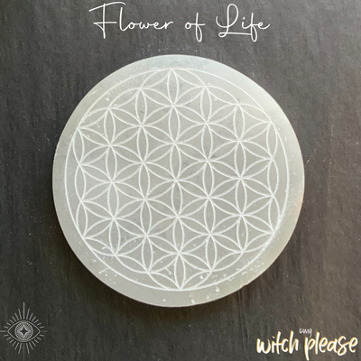 Selenite crystal charging plate engraved with a flower of life