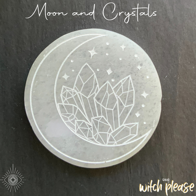 Selenite crystal charging plate engraved with a moon and crystals