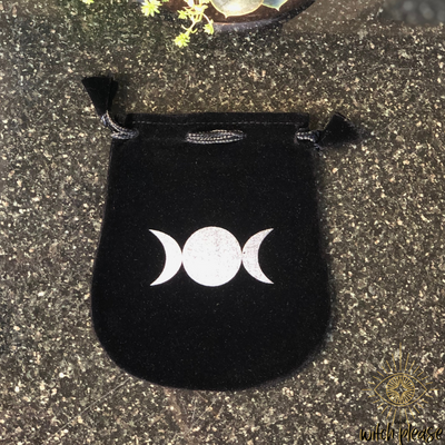 Velvet bag with a silver design of the triple moon or triple goddess.